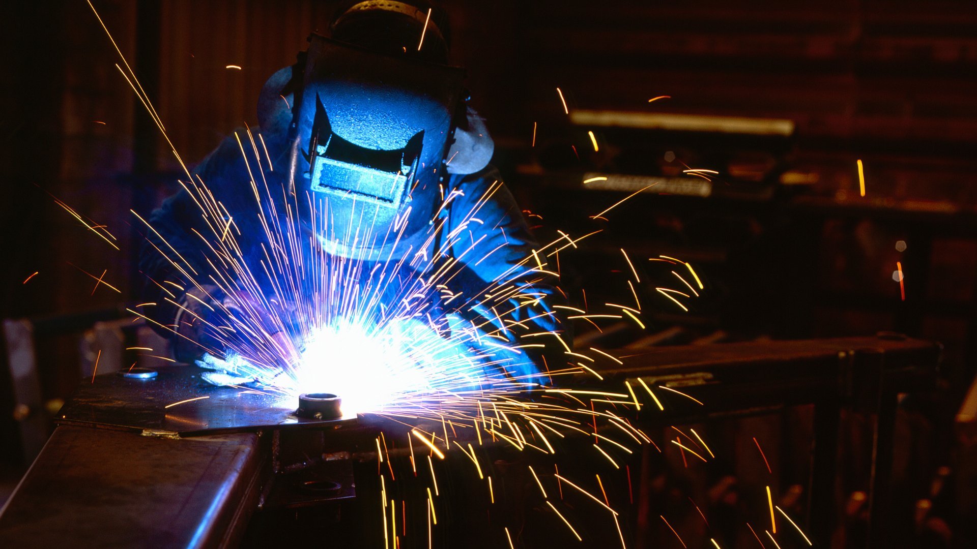 Welder working with sparks